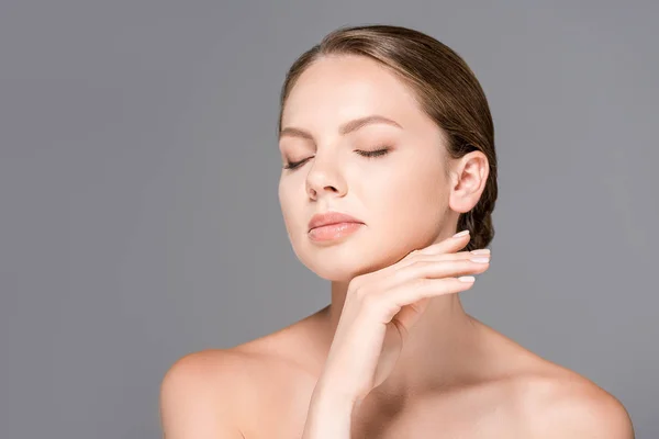 Portrait of beautiful woman with bare shoulders and perfect skin isolated on grey — Stock Photo