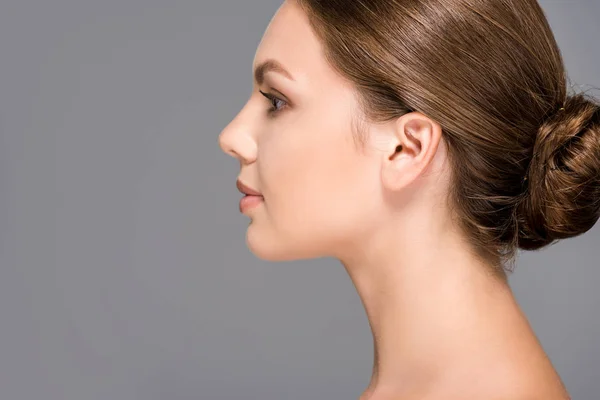 Side view of beautiful woman with perfect skin isolated on grey — Stock Photo