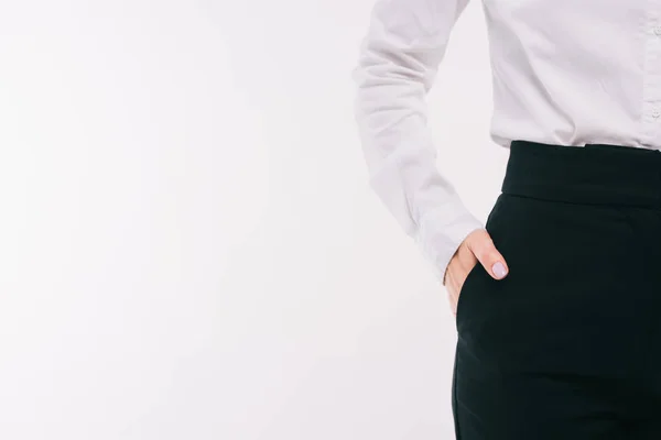 Cropped image of businesswoman standing with hand in pocket isolated on white — Stock Photo