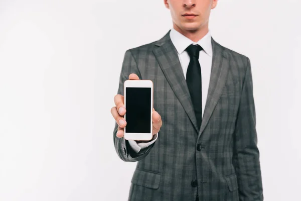 Image recadrée de l'homme d'affaires montrant smartphone avec écran blanc isolé sur blanc — Photo de stock