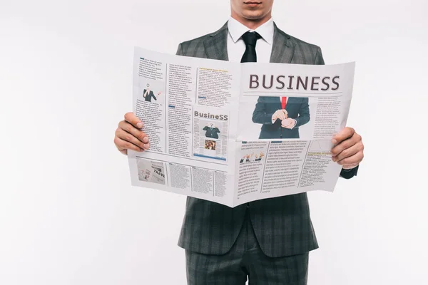Imagem cortada de empresário lendo jornal de negócios isolado em branco — Fotografia de Stock