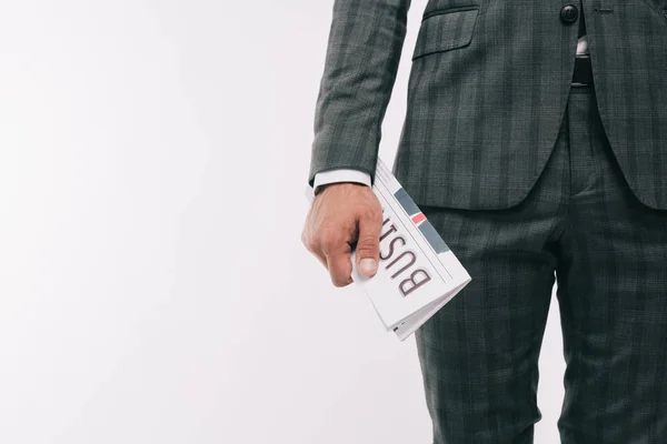 Cropped image of businessman holding business newspaper isolated on white — Stock Photo