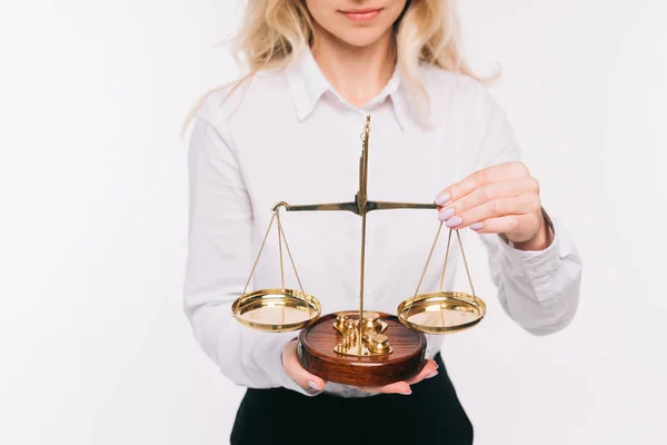 Abgeschnittenes Bild einer Geschäftsfrau, die Waagen auf Weiß hält — Stockfoto