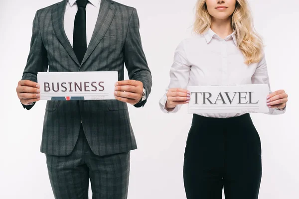 Cropped image of businesspeople holding newspapers isolated on white — Stock Photo