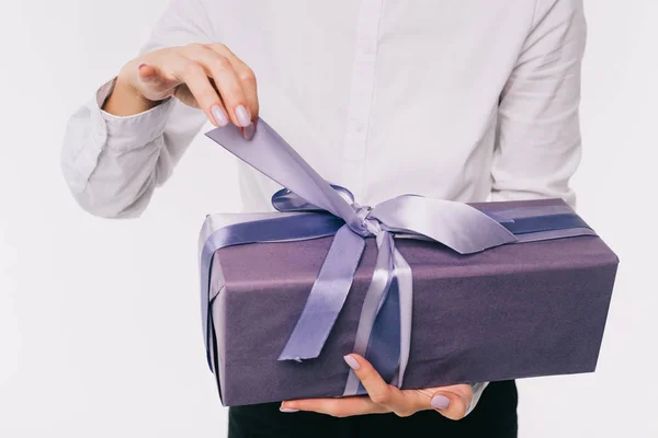 Cropped image of businesswoman opening present box isolated on white — Stock Photo