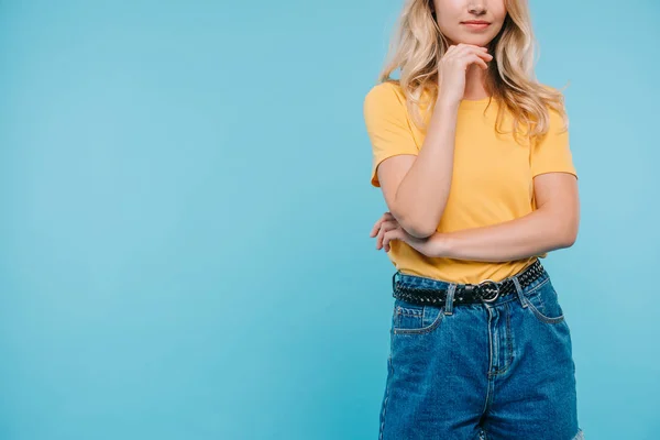 Cropped image of girl resting chin on hand isolated on blue — Stock Photo