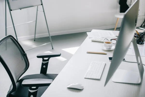 Computer, table and chair in light modern office — Stock Photo