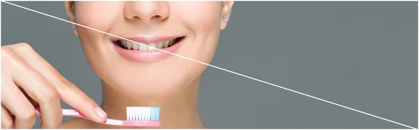 Tiro recortado de mulher sorridente segurando escova de dentes na mão isolado em cinza, dentes branqueamento conceito — Fotografia de Stock