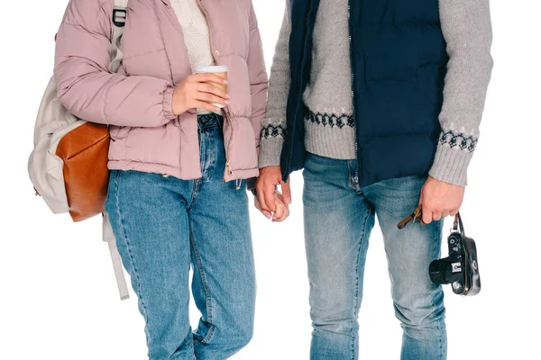 Cropped shot of young tourists holding camera and coffee to go isolated on white — Stock Photo