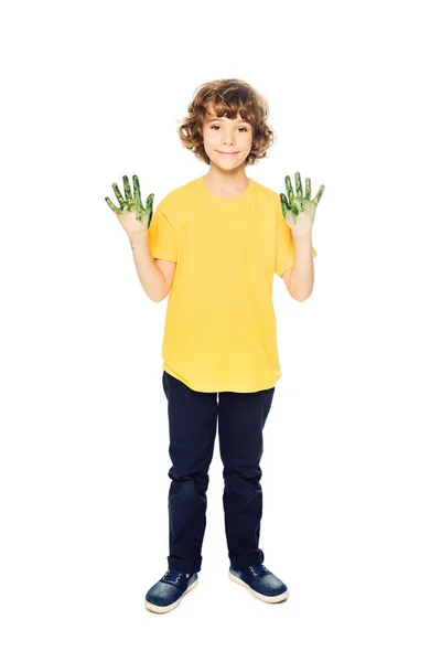 Carino bambino mostrando le mani in vernice e sorridendo alla fotocamera isolato su bianco — Foto stock