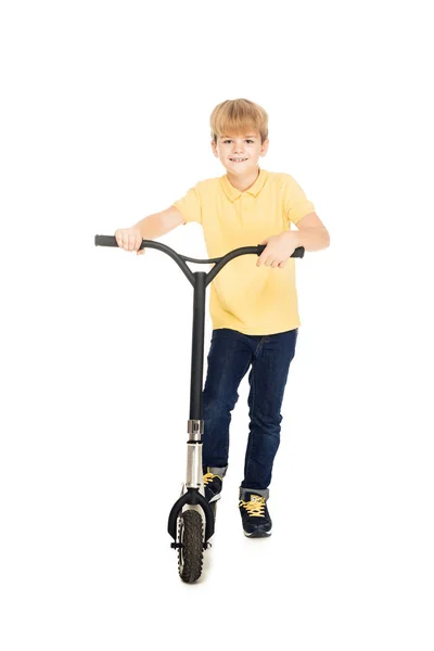 Cute happy little boy standing with scooter and smiling at camera isolated on white — Stock Photo