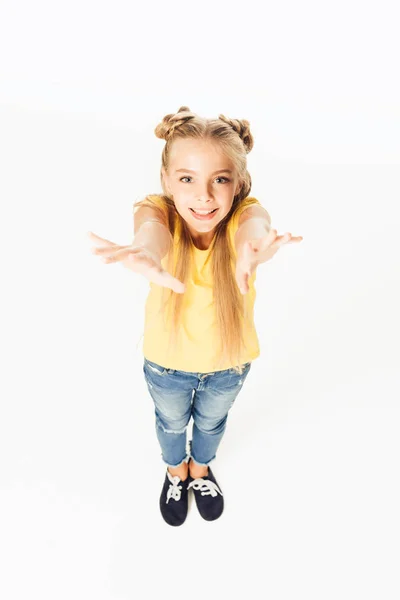 High angle view of beautiful happy child reaching hands and smiling at camera isolated on white — Stock Photo