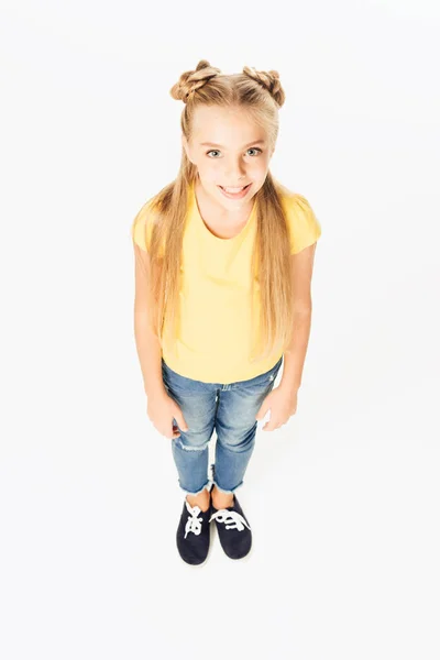 High angle view of beautiful happy child standing and smiling at camera isolated on white — Stock Photo