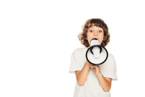 Adorable child yelling in megaphone and looking at camera isolated on white — Stock Photo