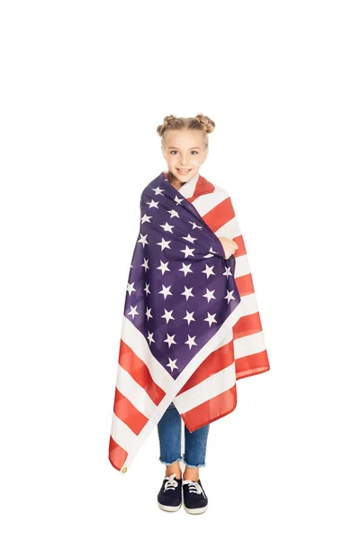 Happy child holding american flag and smiling at camera isolated on white — Stock Photo