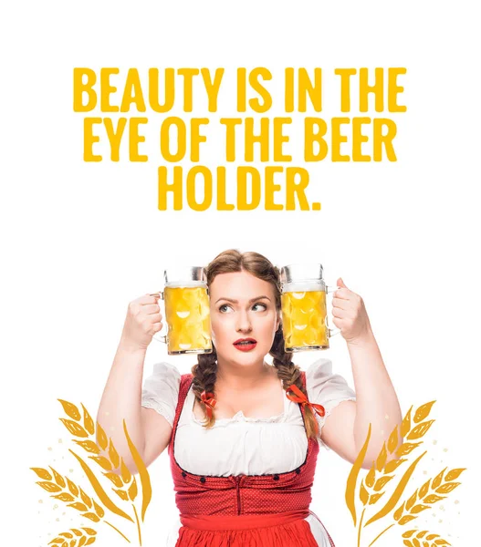 Oktoberfest waitress in traditional bavarian dress putting head between mugs of light beer isolated on white background with 