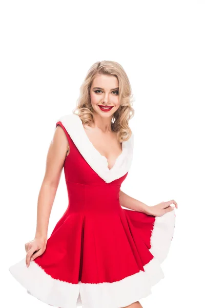 Sonriente chica santa levantando vestido de navidad aislado en blanco - foto de stock