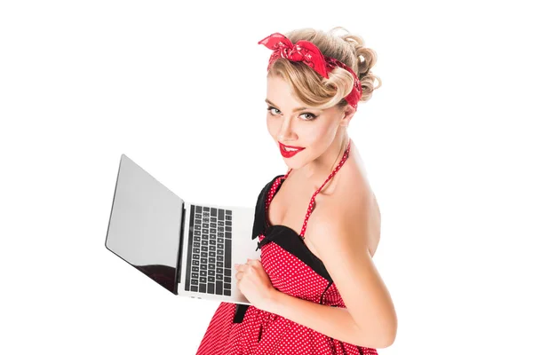 High angle view of young woman in pin up style clothing with laptop isolated on white — Stock Photo