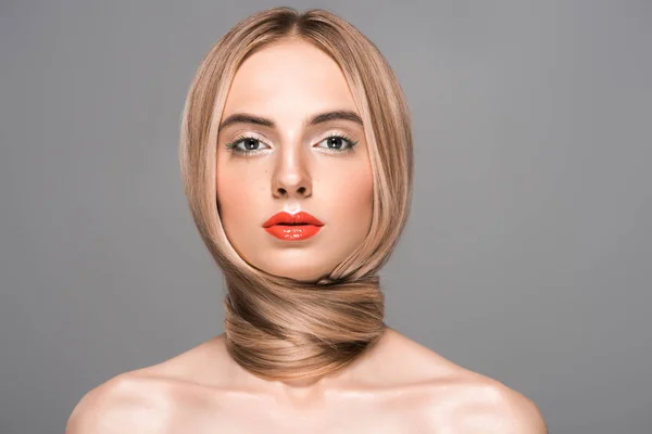 Portrait of beautiful naked woman with long smooth hair looking at camera isolated on grey — Stock Photo