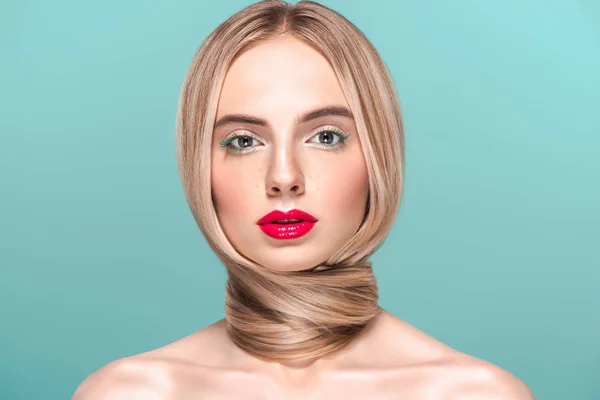 Portrait of beautiful naked woman with long smooth hair around neck looking at camera isolated on blue — Stock Photo