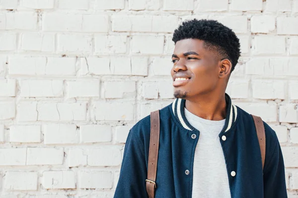 Portrait of young african american man in trendy blue bomber — Stock Photo