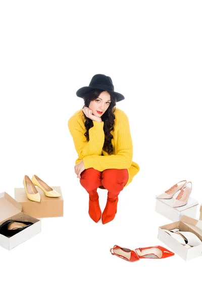 Stylish shopaholic with footwear boxes isolated on white — Stock Photo