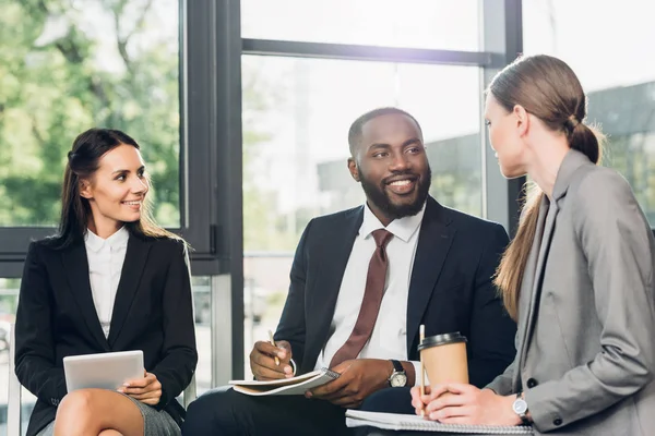 Multicultural business colleagues having meeting in conference hall — Stock Photo