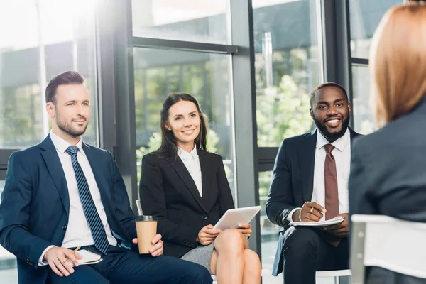 Multicultural business colleagues having meeting in conference hall — Stock Photo