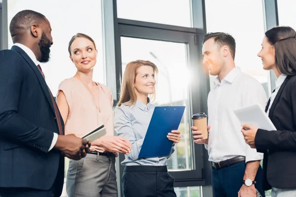 Multicultural businesspeople having meeting in conference hall — Stock Photo