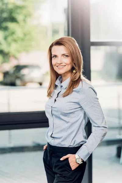 Portrait of smiling businesswoman in conference hall — Stock Photo