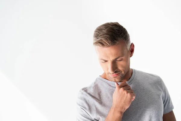 Thoughtful adult man in blank grey t-shirt touching his chin and looking down isolated on white — Stock Photo