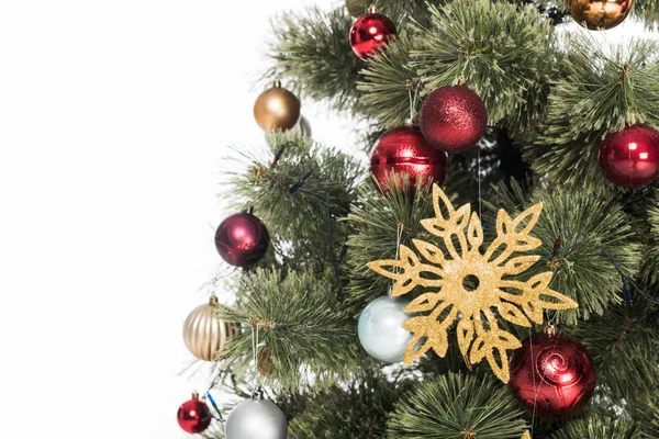 Close up view of decorative toys on christmas tree isolated on white — Stock Photo