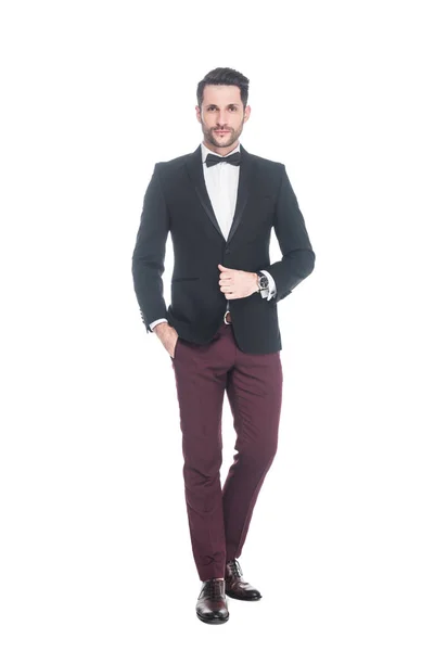 Joven hombre guapo en traje de moda aislado en blanco - foto de stock