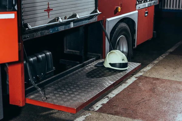 Close up view of protective helmet on fire truck at fire department — Stock Photo