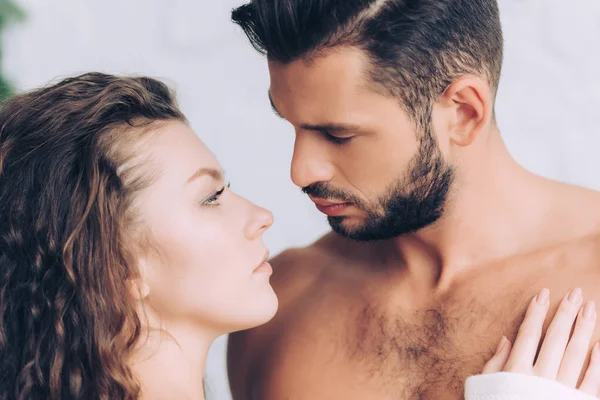 Side view of young couple looking at each other — Stock Photo