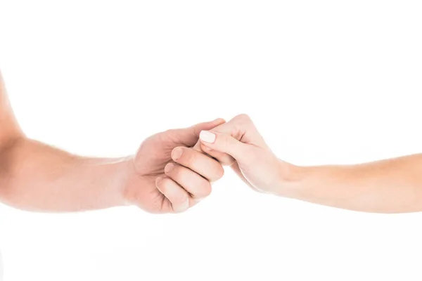 Partial view of people tenderly holding hands isolated on white — Stock Photo