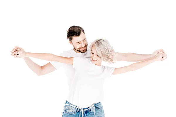Maravillosa pareja sosteniendo frudamente las manos extendidas aisladas en blanco - foto de stock