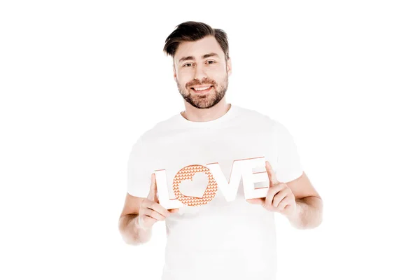 Schöner lächelnder junger erwachsener Mann zeigt Liebeszeichen isoliert auf weißem Grund — Stockfoto
