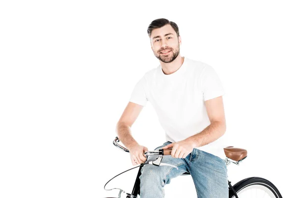 Красивий усміхнений чоловік їде на велосипеді ізольовано на білому — стокове фото