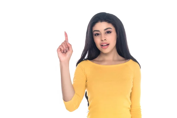 Young african american woman pointing up with finger and looking at camera isolated on white — Stock Photo