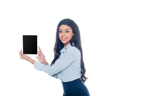 Beautiful african american girl holding digital tablet with blank screen and smiling at camera isolated on white — Stock Photo