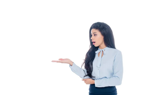 Surprised african american businesswoman pointing by hand  isolated on white — Stock Photo