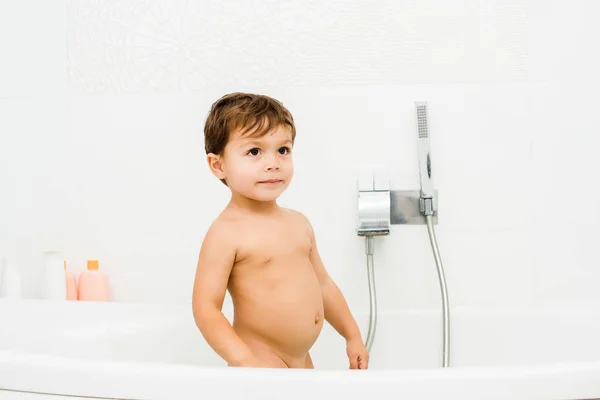 Toddler boy standing in white clean white bathroom — Stock Photo