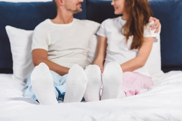 Cropped view of happy couple resting at home — Stock Photo