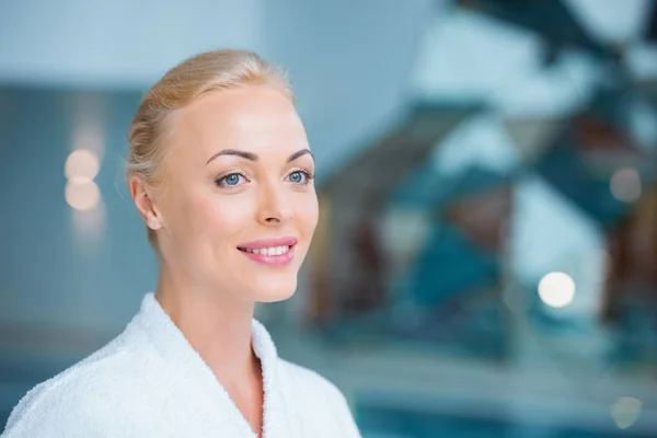 Close up of beautiful woman standing in white bathrobe — Stock Photo