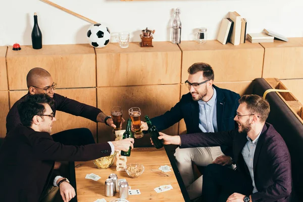 High angle view of multiracial business team clinking drinks while resting together in cafe — Stock Photo