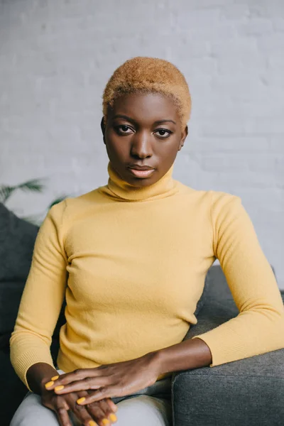 Selective focus of confident african american woman with short hair — Stock Photo