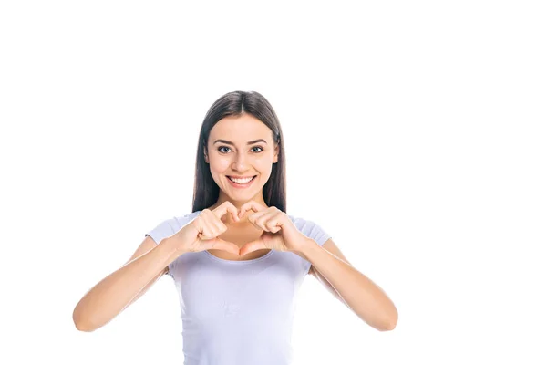 Portrait of smiling woman showing heart sign isolated on white — Stock Photo