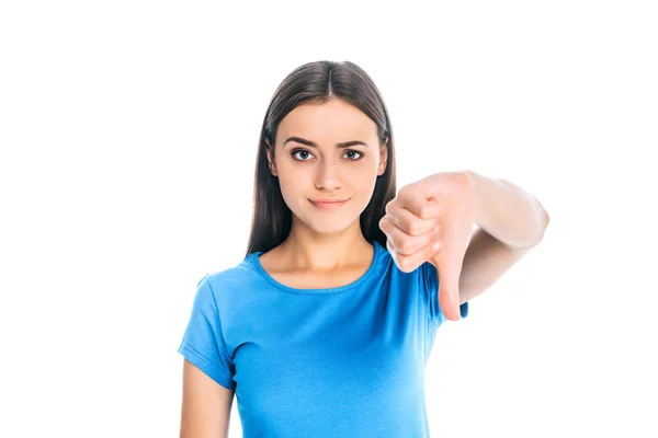 Retrato de mujer atractiva mostrando el pulgar hacia abajo aislado en blanco - foto de stock