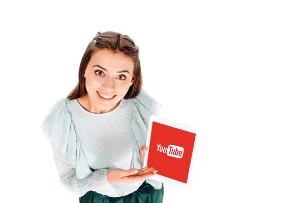 High angle view of smiling woman with tablet with youtube logo on screen isolated on white — Stock Photo